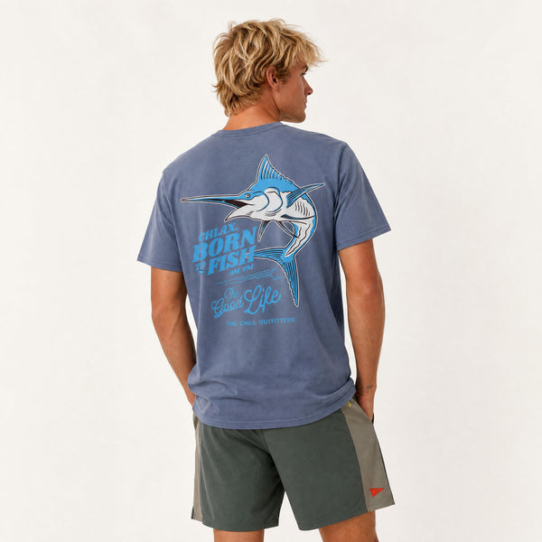 A man shown from the back wearing a faded slate blue t-shirt with a large marlin graphic and 'CHLAX Born to Fish Good Life' text, paired with dark gray shorts, against a plain white background.