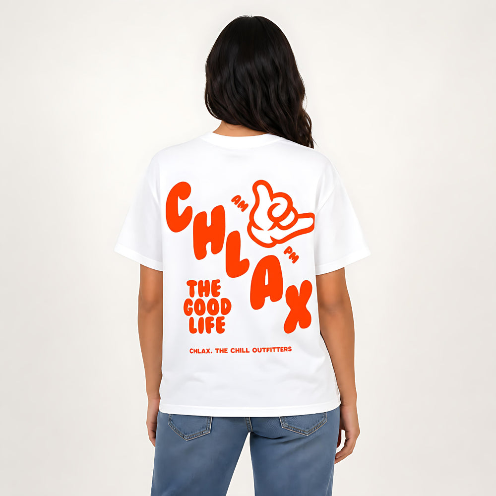 A woman with long dark hair wearing a white oversized t-shirt with a red 'CHLAX' graphic on the chest, paired with blue jeans, standing against a plain off-white background.