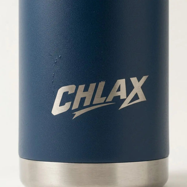Close-up of a dark blue insulated tumbler with a brushed silver metal base and a silver 'CHLAX' logo printed on the front.