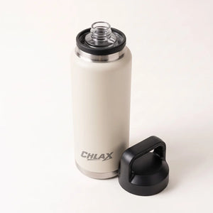 A CHLAX insulated water bottle in a warm off-white color with a black lid and a separate black carrying loop, shown on a clean white background.