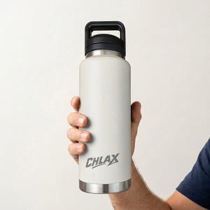 A hand holding a matte white insulated water bottle with a black handle lid and silver metal trim. The bottle features the brand name 'CHLAX' printed in gray near the bottom.