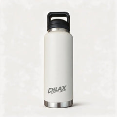 A matte off-white insulated water bottle with a black carrying loop lid and a silver metal base, featuring the CHLAX logo printed in gray. #driftwood