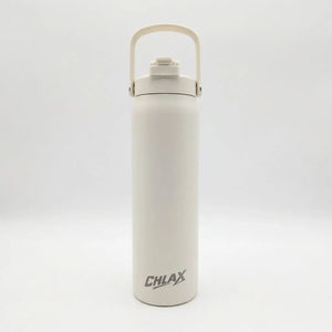 A tall, cylindrical insulated water bottle in a warm off-white or cream color, featuring a matching cream carrying loop lid and a dark gray 'CHLAX' logo near the bottom. The bottle is photographed against a seamless, light gray studio background.