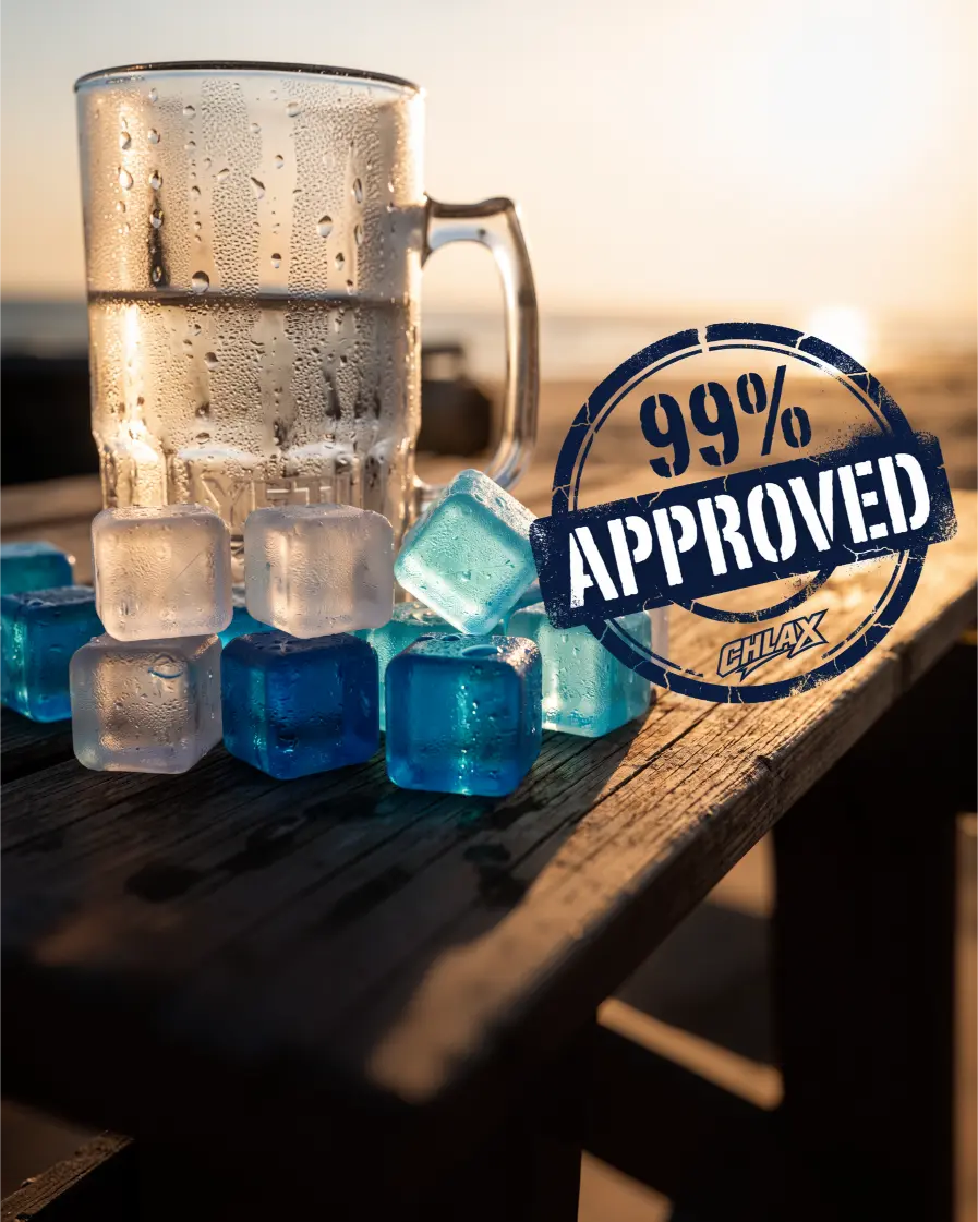 A clear glass beer mug covered in condensation, placed on a wooden table with several translucent blue ice cubes. A large circular stamp overlay reads '99% APPROVED' with a small 'GELAX' logo below it.