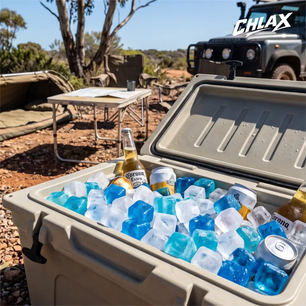 CHLAX reusable ice cubes in a beige hard shell cooler with visible beer bottles at a camp site in the Australian bush.