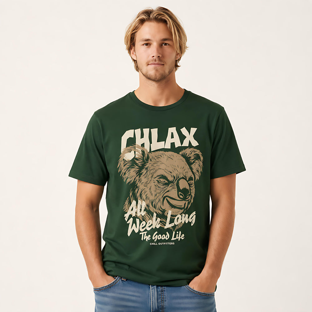 A man wearing a dark green graphic t-shirt with a koala illustration and the text 'CHLAX All Week Long The Good Life' by Chill Outfitters, paired with blue jeans against a light off-white background.