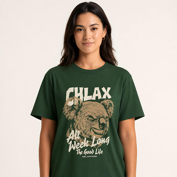 A woman wearing a dark green graphic t-shirt with a koala illustration and the text 'CHLAX All Week Long The Good Life'.