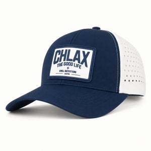 A navy blue and white trucker-style baseball cap with a white rectangular patch on the front that reads 'CHLAX THE GOOD LIFE' and 'CHILL OUTFITTERS'.