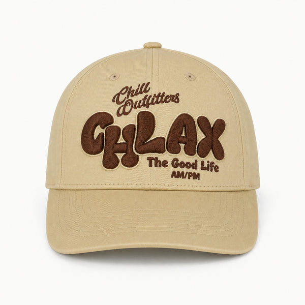 A beige baseball cap with brown embroidered text reading 'Chill Outfitters CHLAX The Good Life AM/PM' on the front, shown against a plain white background.
