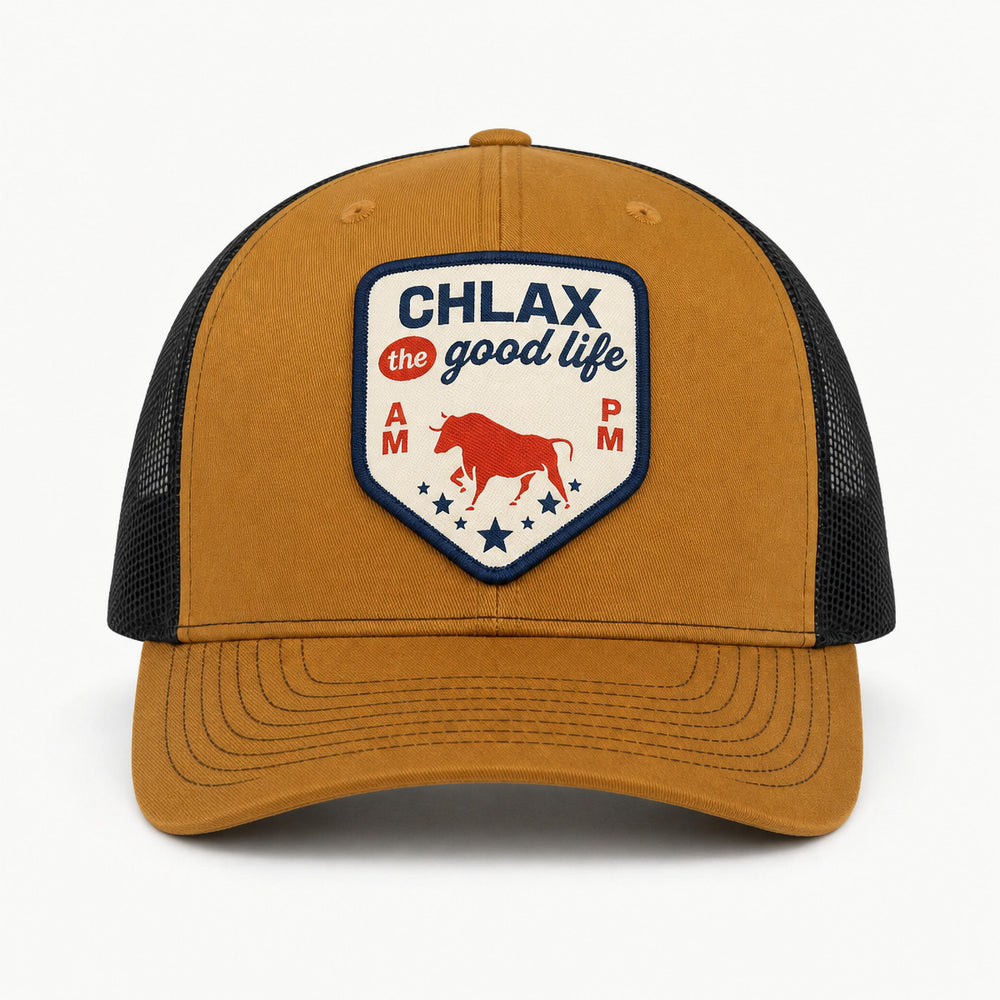A brown and black trucker hat with a curved brim, featuring a front patch that reads 'CHLAX for good life' with a red bull graphic, set against a plain white background.