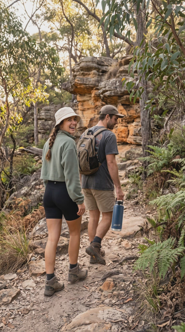 A couple in hiking clothes in the Australian bush carrying a blue CHLAX insulated bottle video.